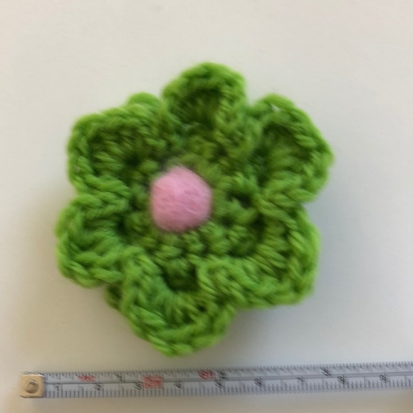 Crochet flower pin adds a bit of fun to your winter wardrobe - Picture 3 of 3